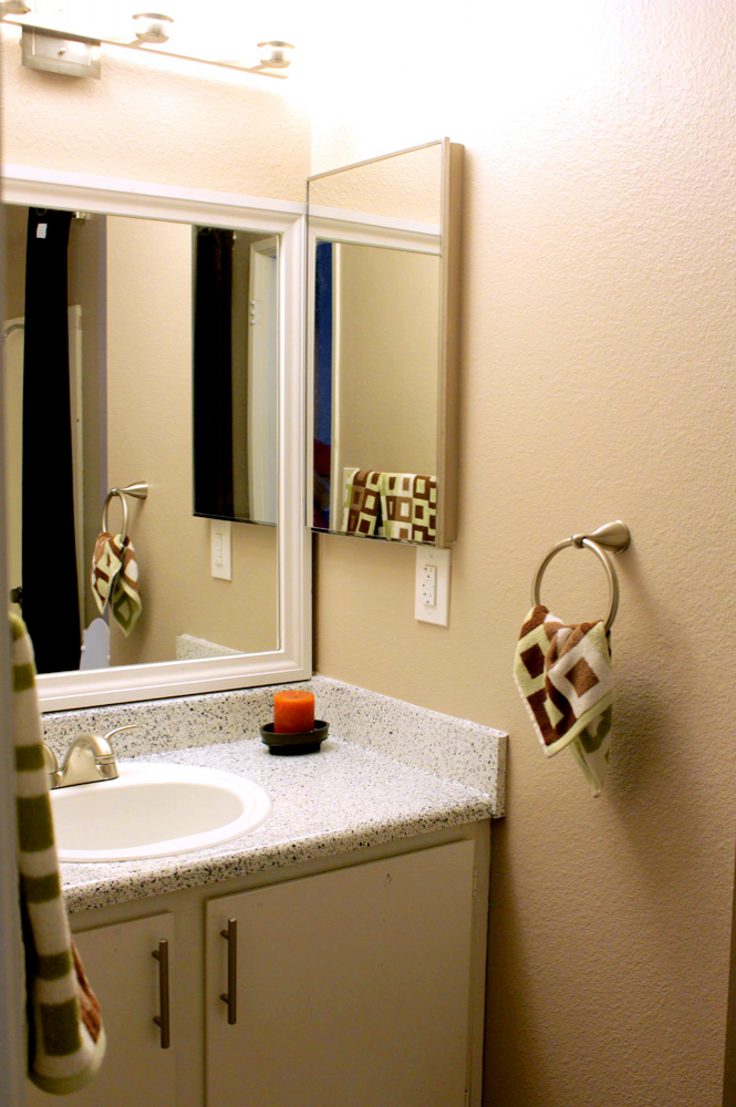 Photo of a stylish bathroom vanity and mirror