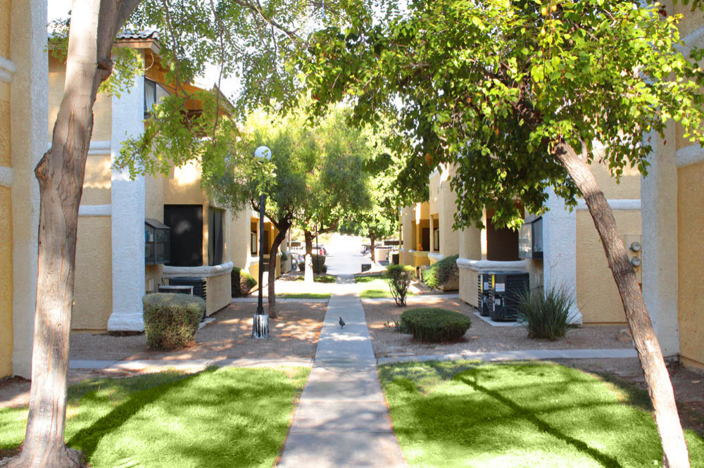 Exterior photo of Sunset Springs apartment Courtyard and Walkway 1