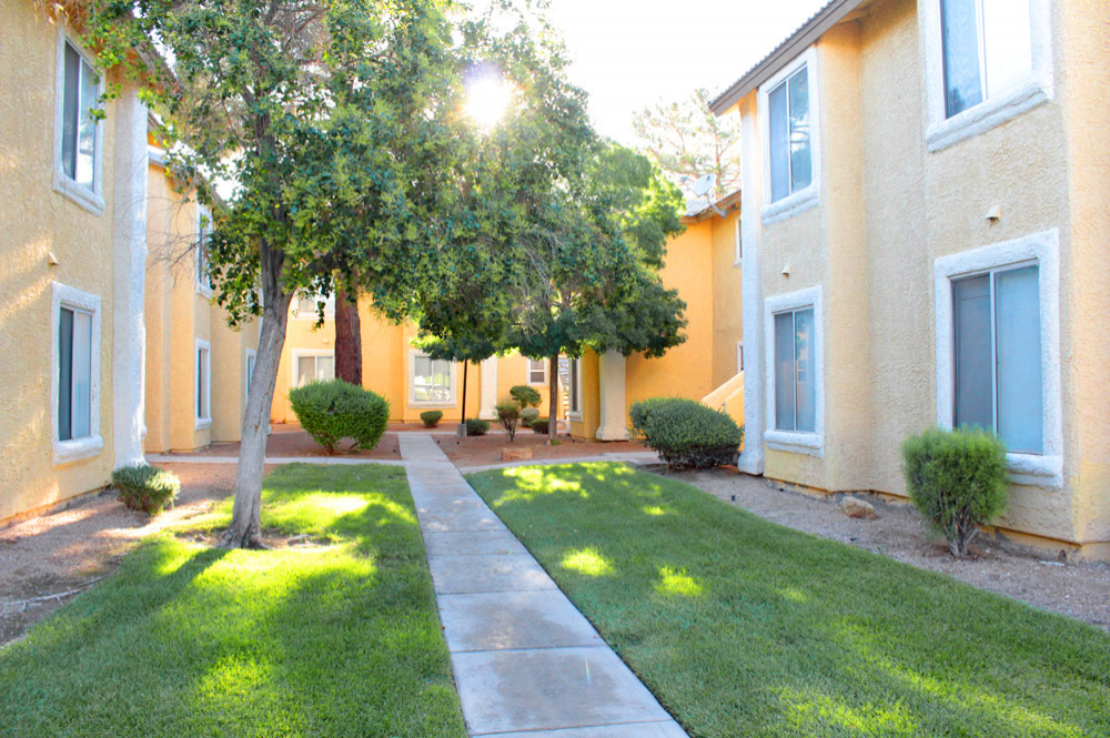 Exterior photo of Sunset Springs apartment Walkway and Building 3
